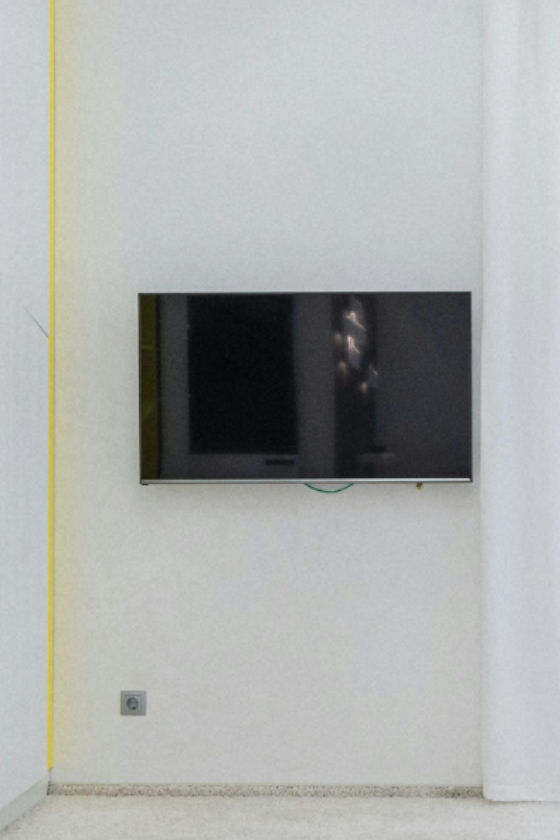 TV mounted cleanly on a white wall